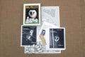 Dissection kit for education purposes including pellets, probes, skeleton, and instructional materials laid out on a table.