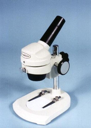 A white microscope with a black stage plate and adjustable focus knob, designed for educational or industrial use.