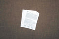 A printed owl pellet dissection worksheet on a brown surface.
